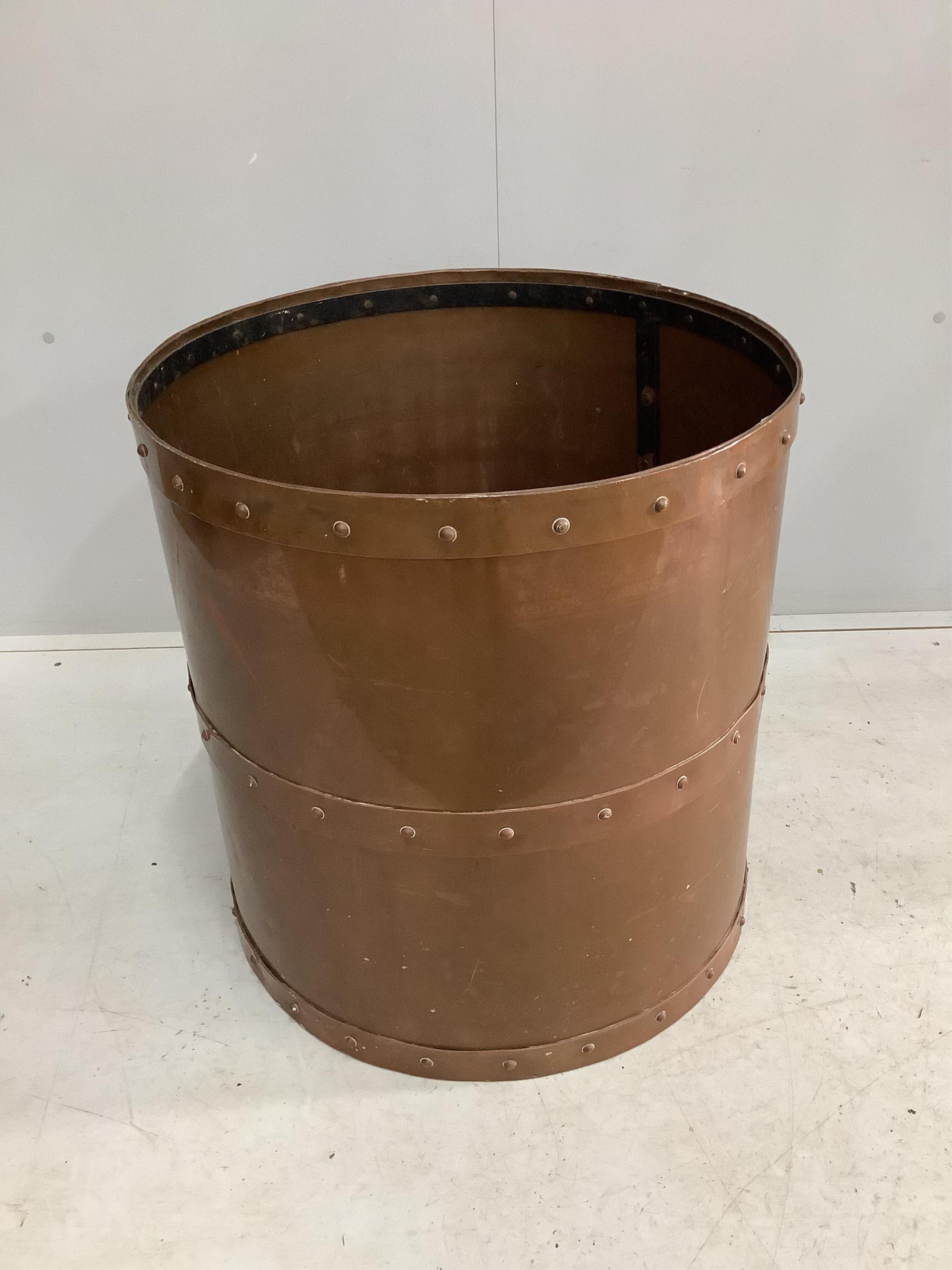 A large copper tub with wrought iron internal banding, diameter 58cm, height 61cm. Condition - good